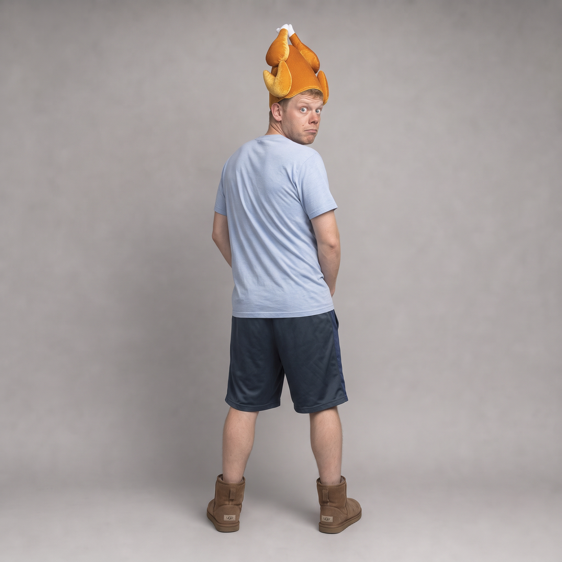 Back view of the roast turkey hat, the wearer looking over his shoulder