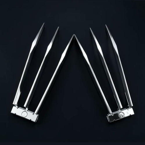 A pair of ClawX folding claws held open in one hand