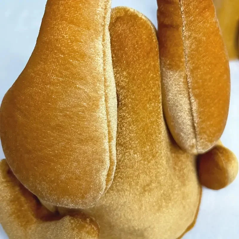 Close up of the golden plush on the roast turkey hat
